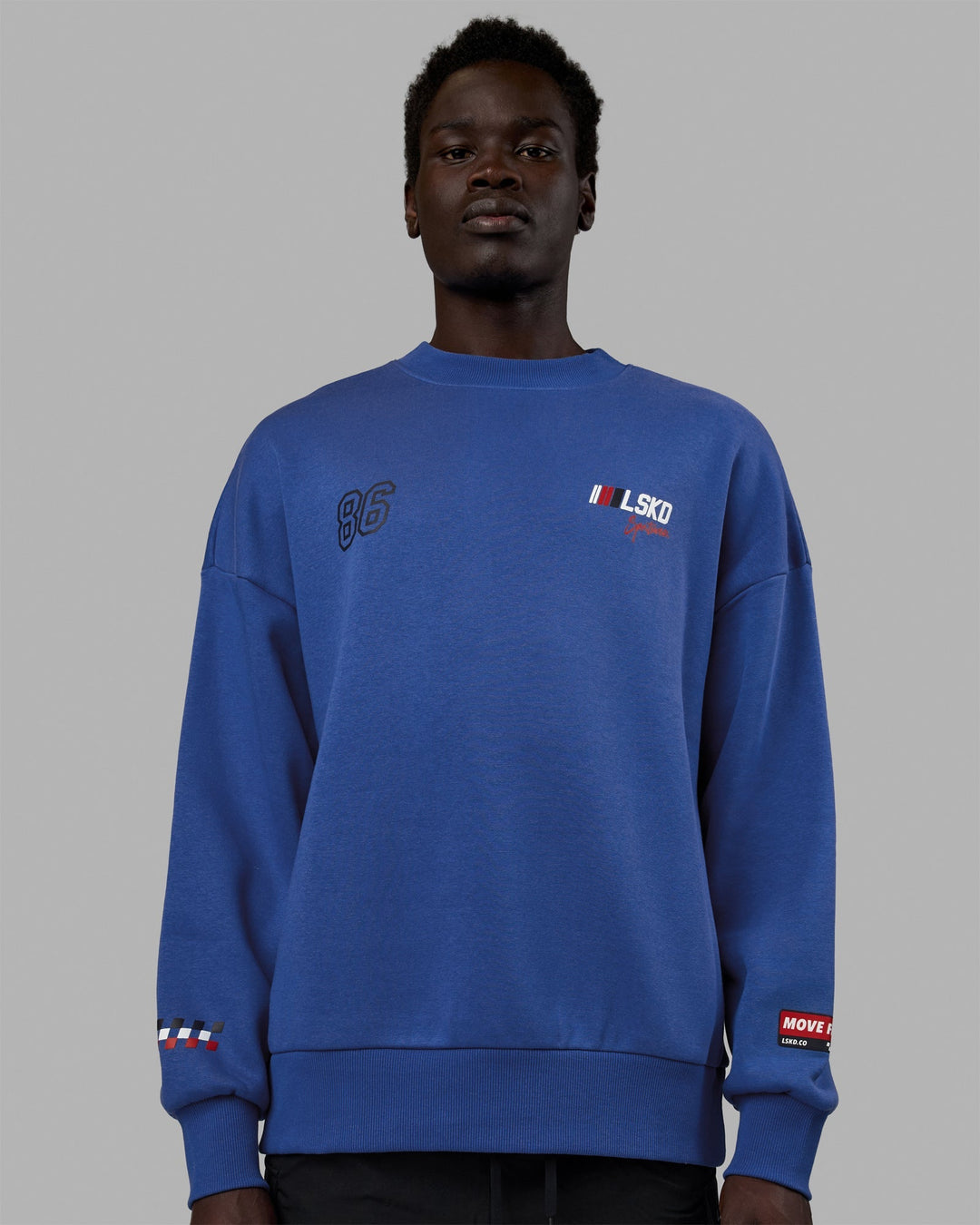 Man wearing Unisex Redline Sweater Oversize - Power Cobalt-White