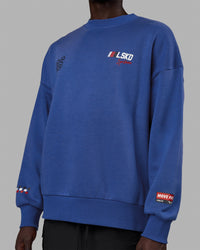 Man wearing Unisex Redline Sweater Oversize - Power Cobalt-White