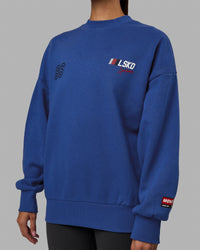 Woman wearing Unisex Redline Sweater Oversize - Power Cobalt-White