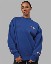 Woman wearing Unisex Redline Sweater Oversize - Power Cobalt-White
