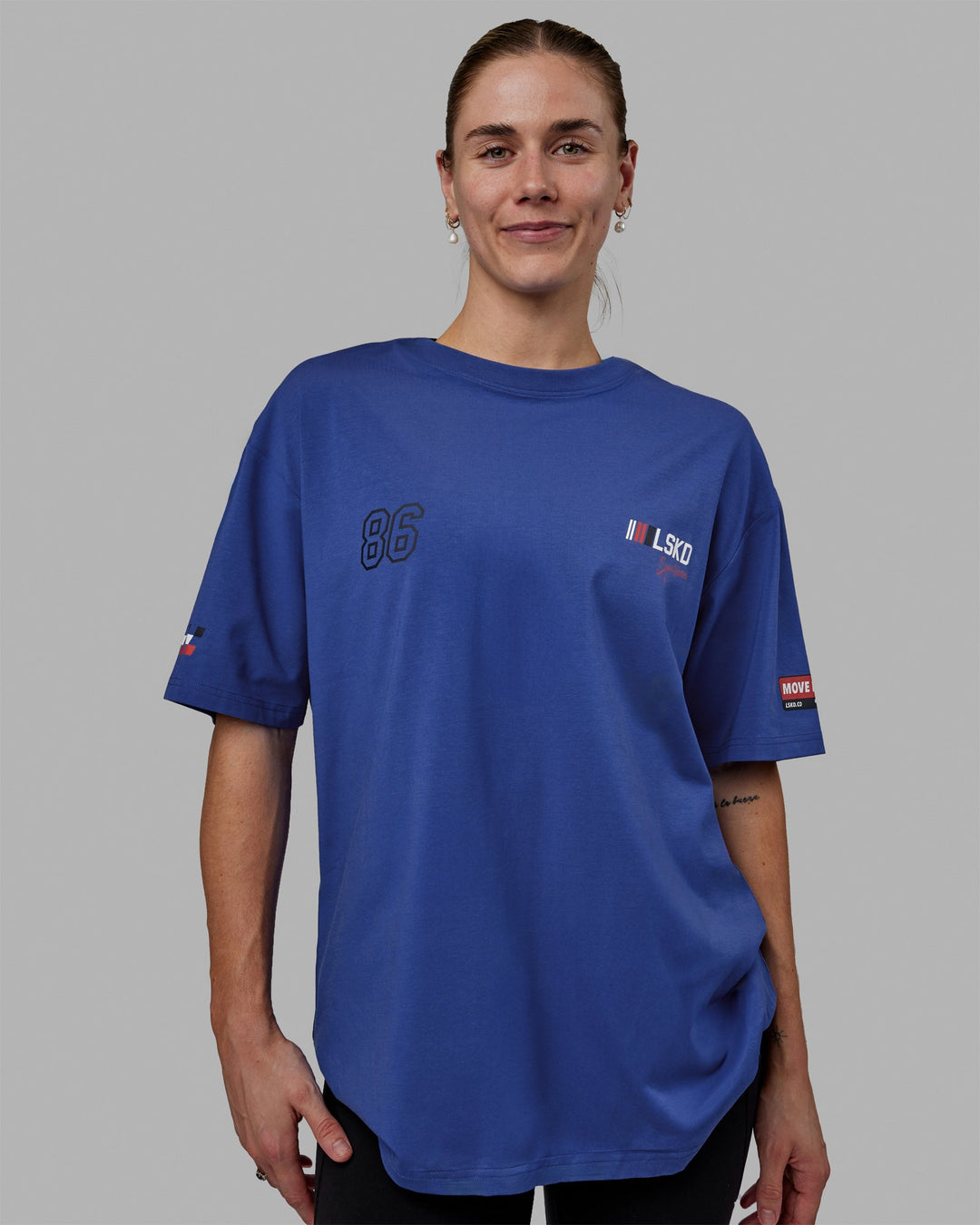 Woman wearing Unisex Redline FLXCotton Tee Oversize - Power Cobalt-White