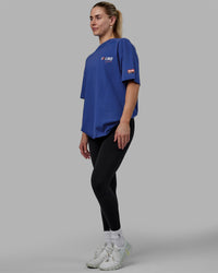 Woman wearing Unisex Redline FLXCotton Tee Oversize - Power Cobalt-White