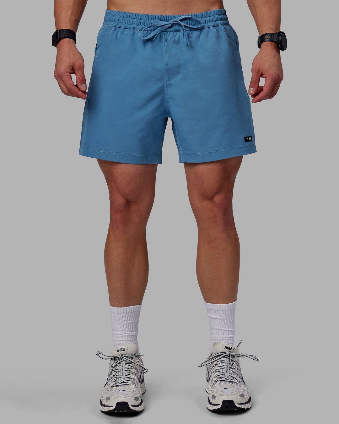 Man wearing Rep 5&quot; Lined Performance Shorts - Elemental Blue