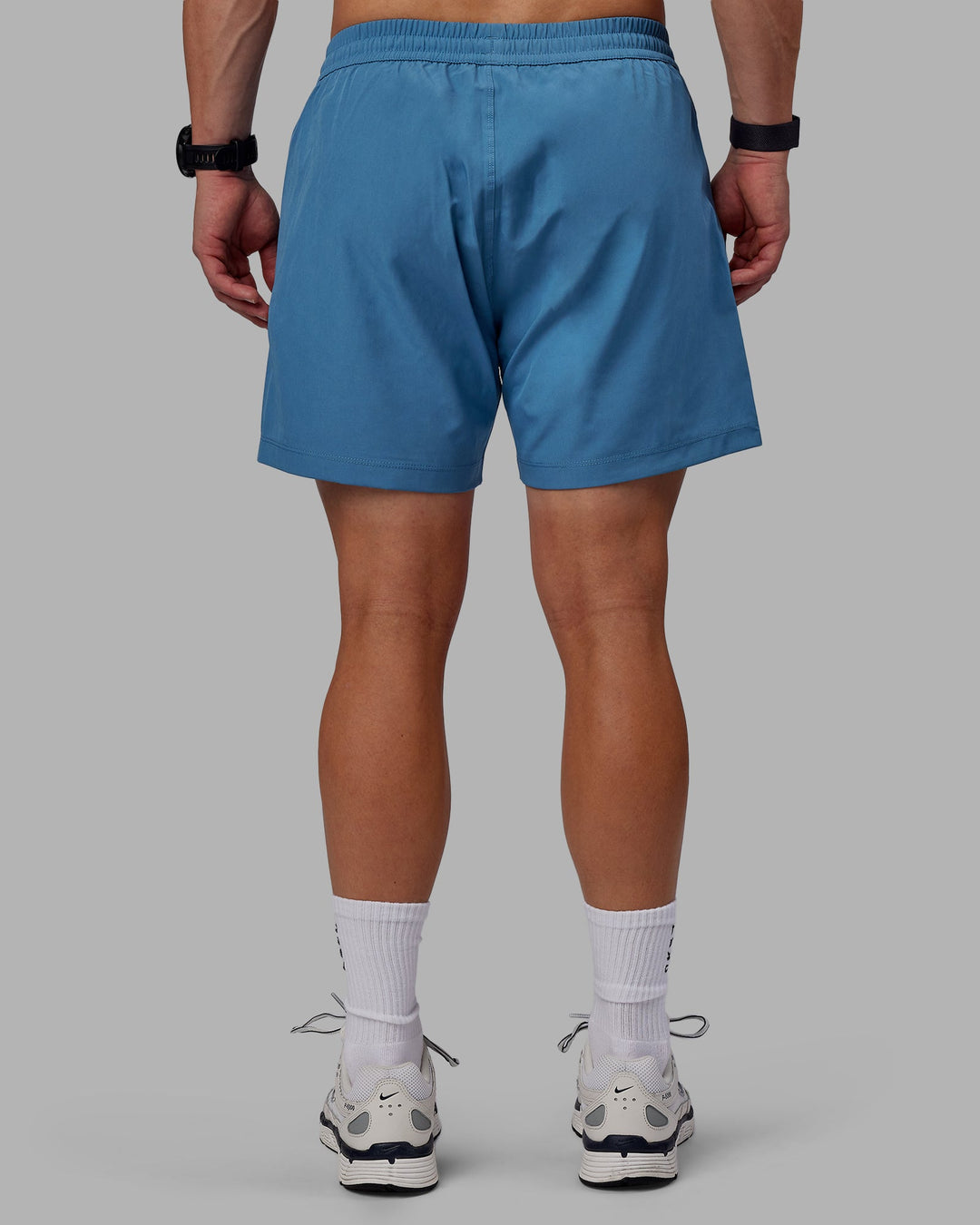 Man wearing Rep 5&quot; Lined Performance Shorts - Elemental Blue