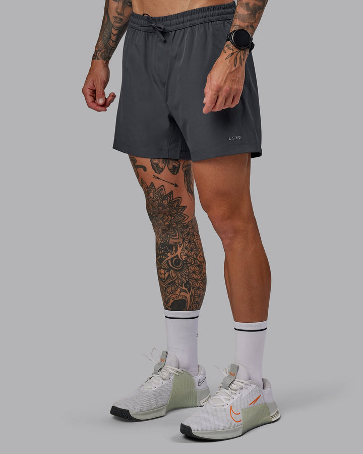 Man wearing Rep 5&quot; Lined Performance Shorts - Dark Storm
