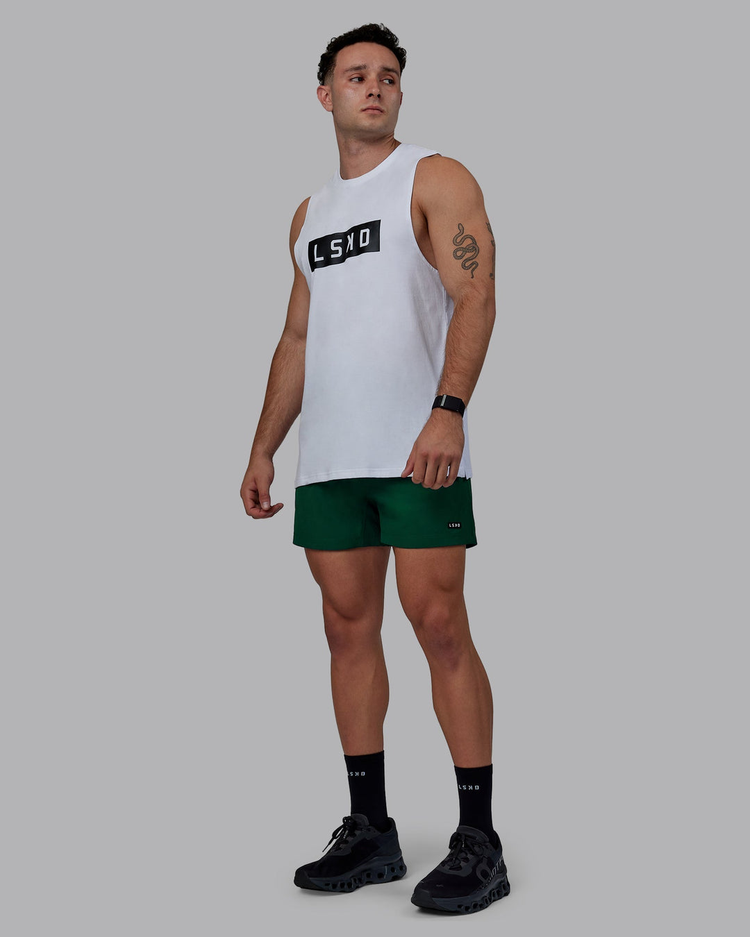 Man wearing Rep 5&quot; Performance Shorts - Deep Emerald