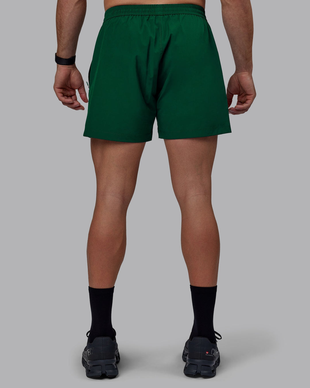 Man wearing Rep 5&quot; Performance Shorts - Deep Emerald