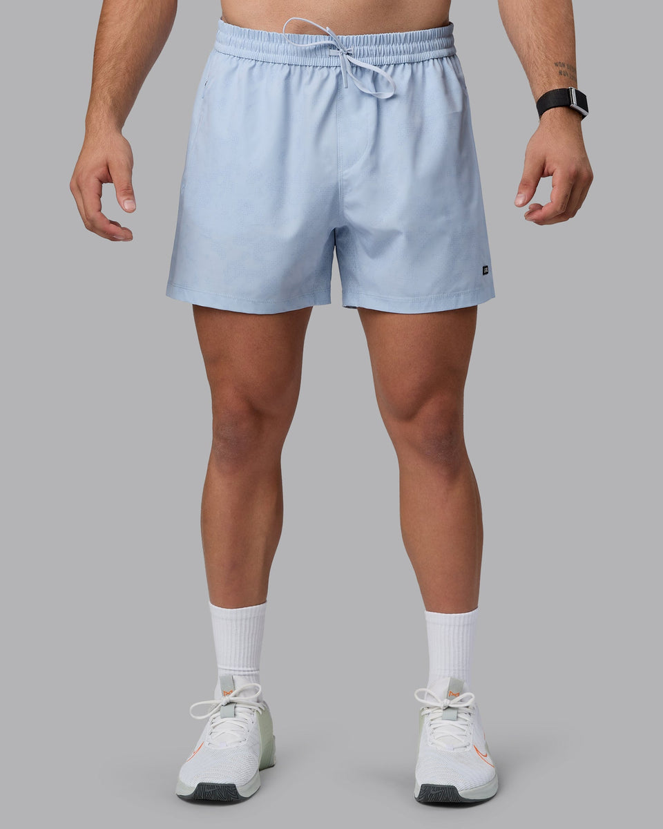 Man wearing Rep 5" Performance Shorts - Digital Camo Ice Blue