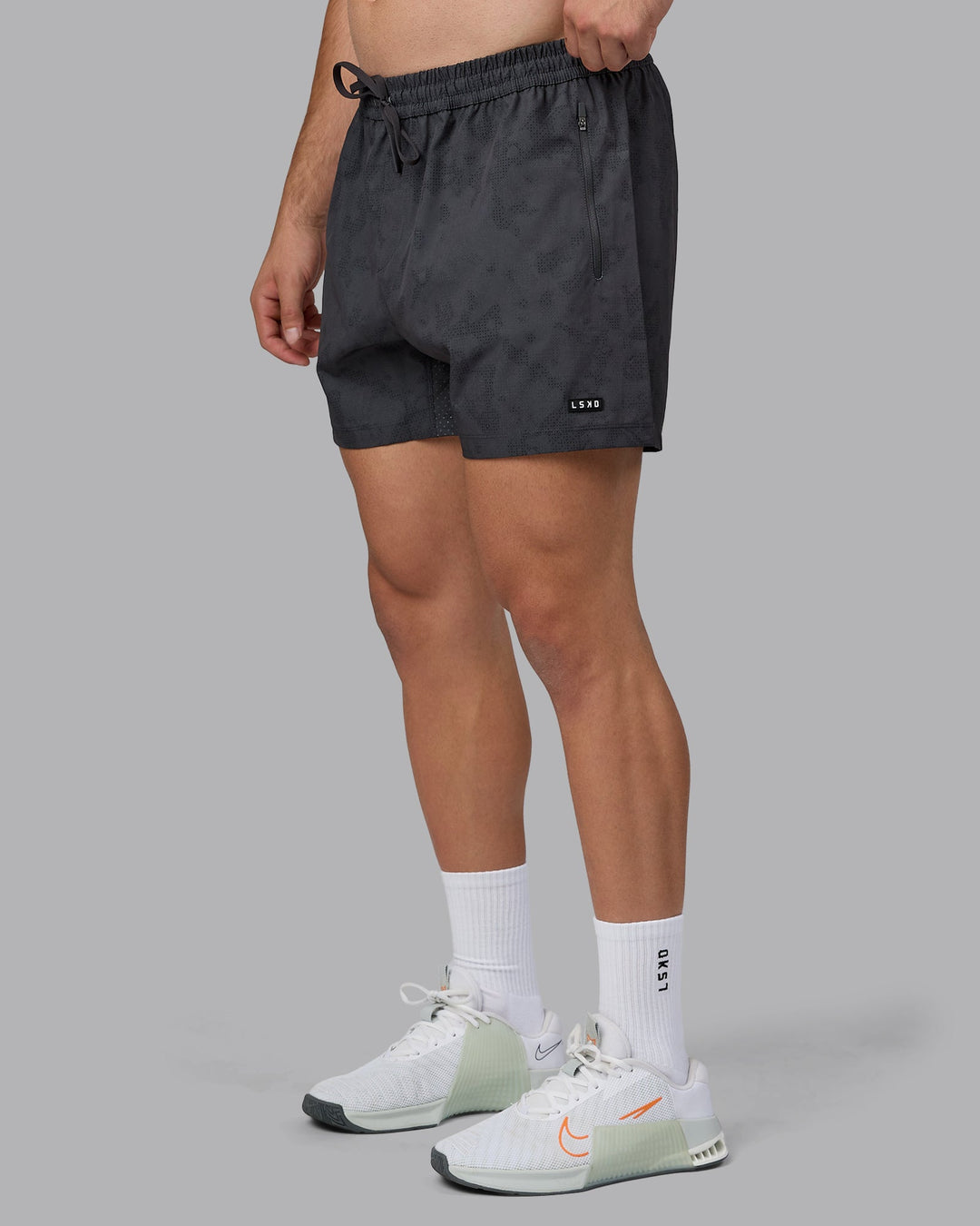 Man wearing Rep 5&quot; Performance Shorts - Digital Camo Pirate Black