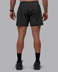 Man wearing Rep 5" Performance Shorts - Pirate Black