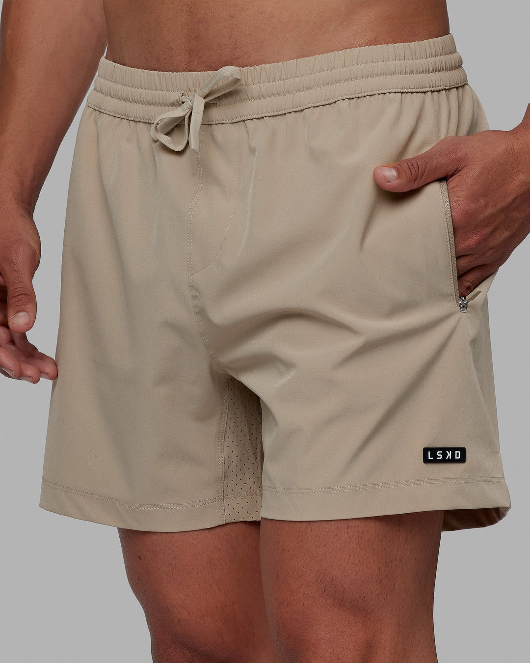 Man wearing Rep 5'' Performance Short - Taupe