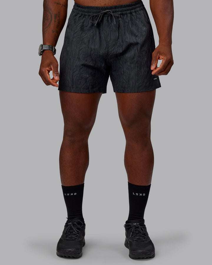 Man wearing Rep 5&quot; Performance Shorts - Topographic Black 
