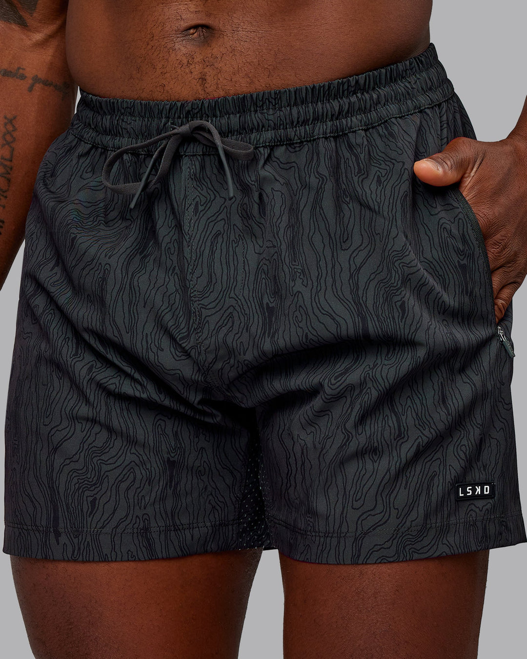 Man wearing Rep 5&quot; Performance Shorts - Topographic Black 