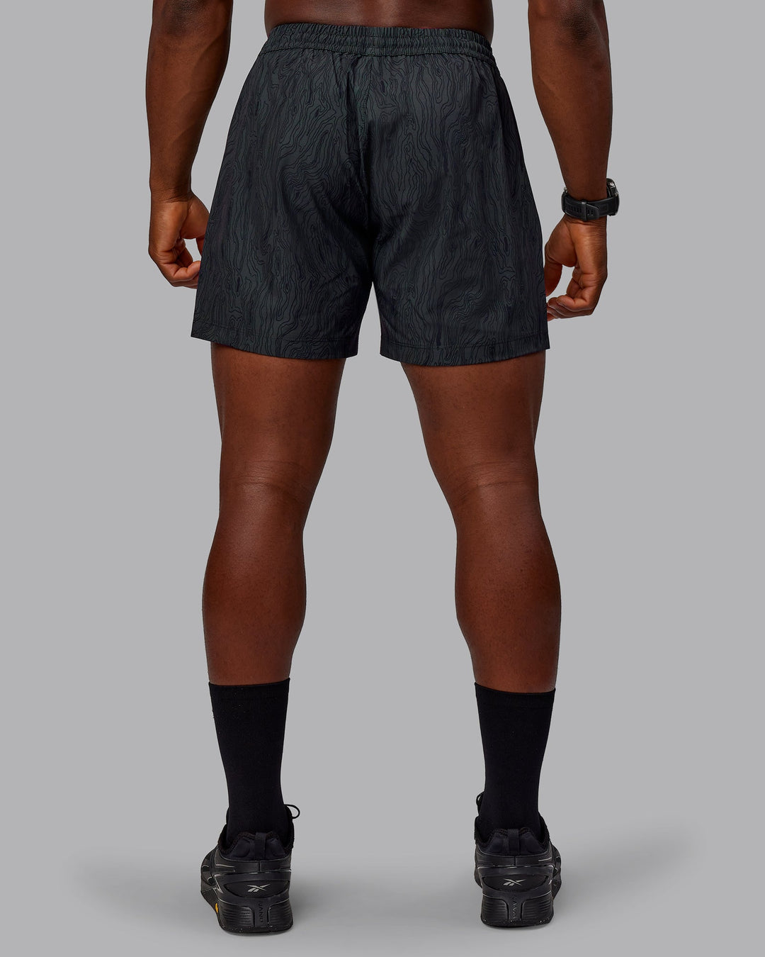 Man wearing Rep 5&quot; Performance Shorts - Topographic Black 