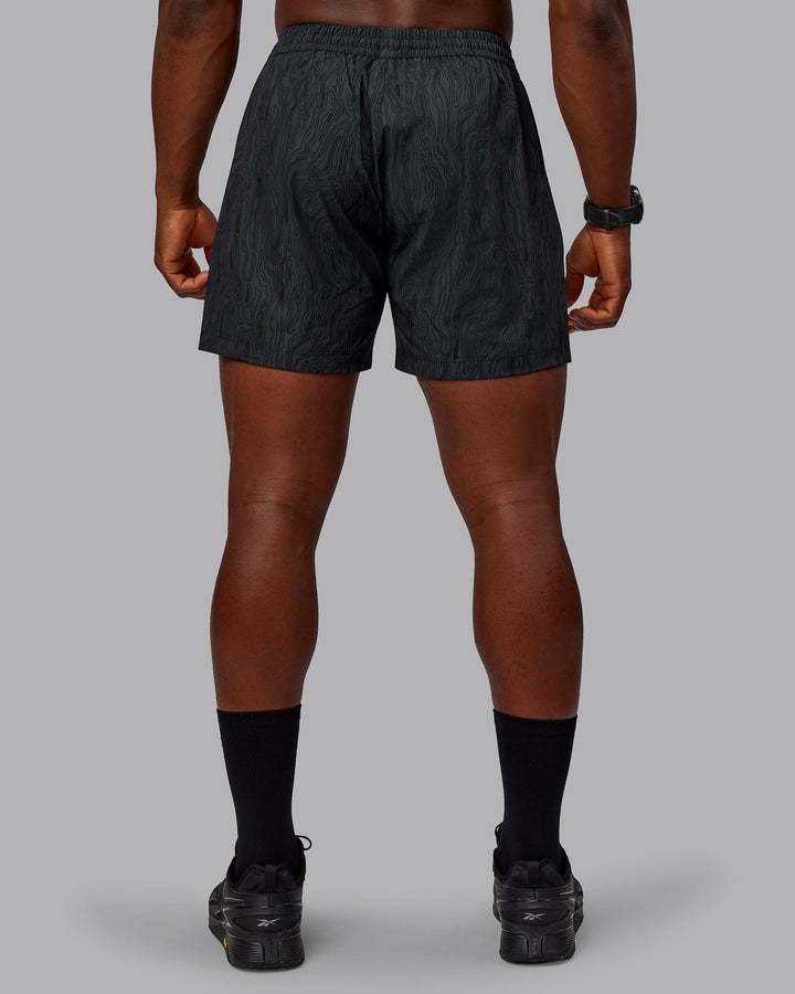 Man wearing Rep 5&quot; Performance Shorts - Topographic Black 
