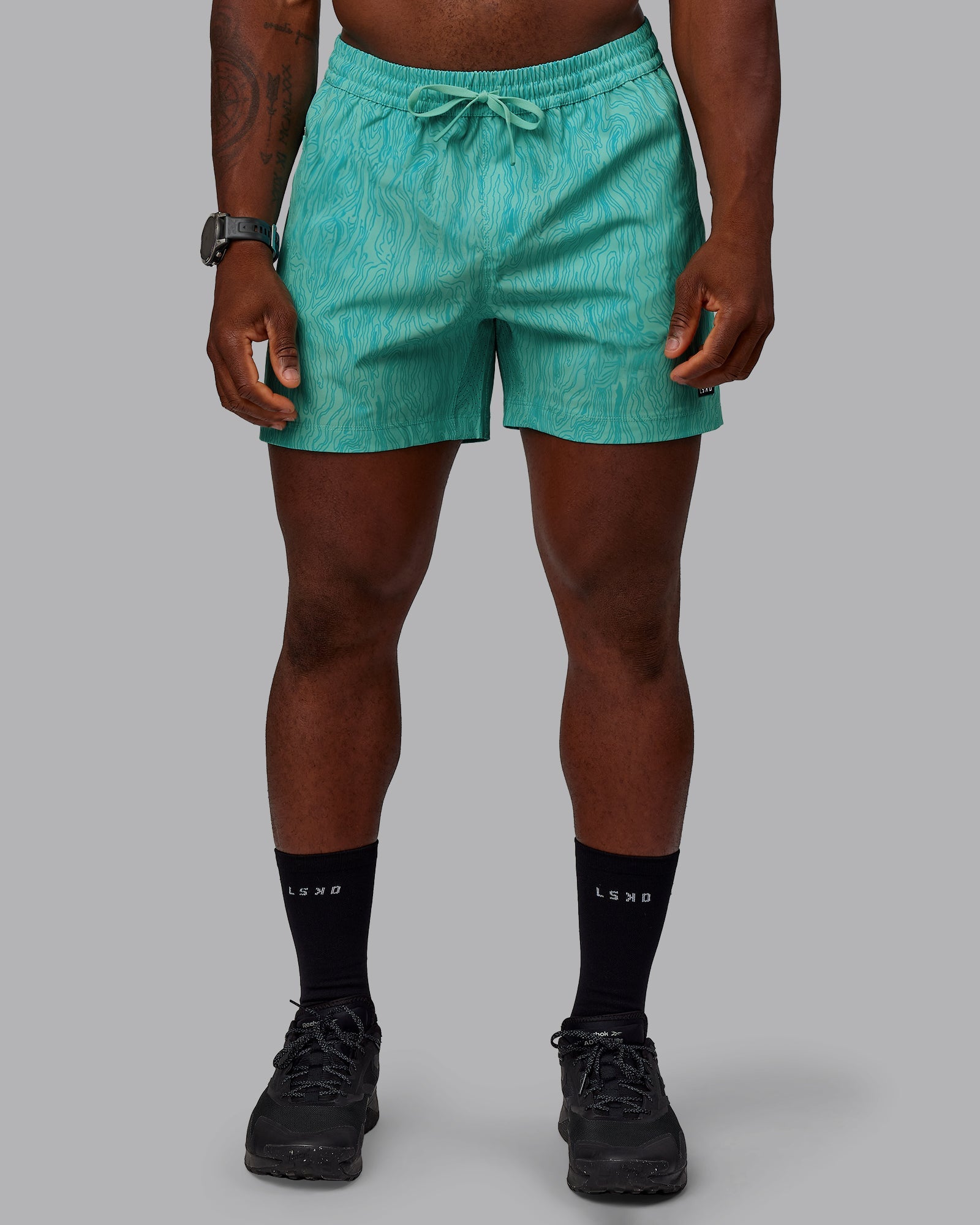 Man wearing Rep 5" Performance Shorts - Topographic Blue Bird