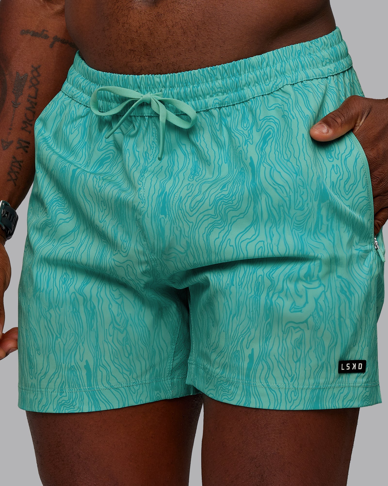 Man wearing Rep 5" Performance Shorts - Topographic Blue Bird