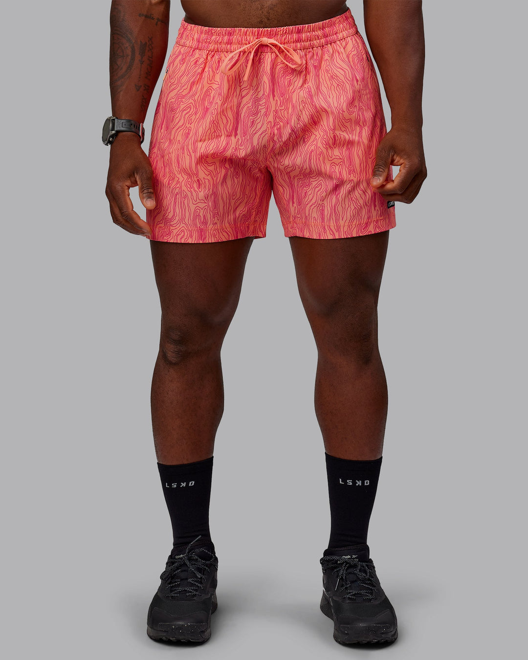 Man wearing Rep 5&quot; Performance Shorts - Topographic Peach