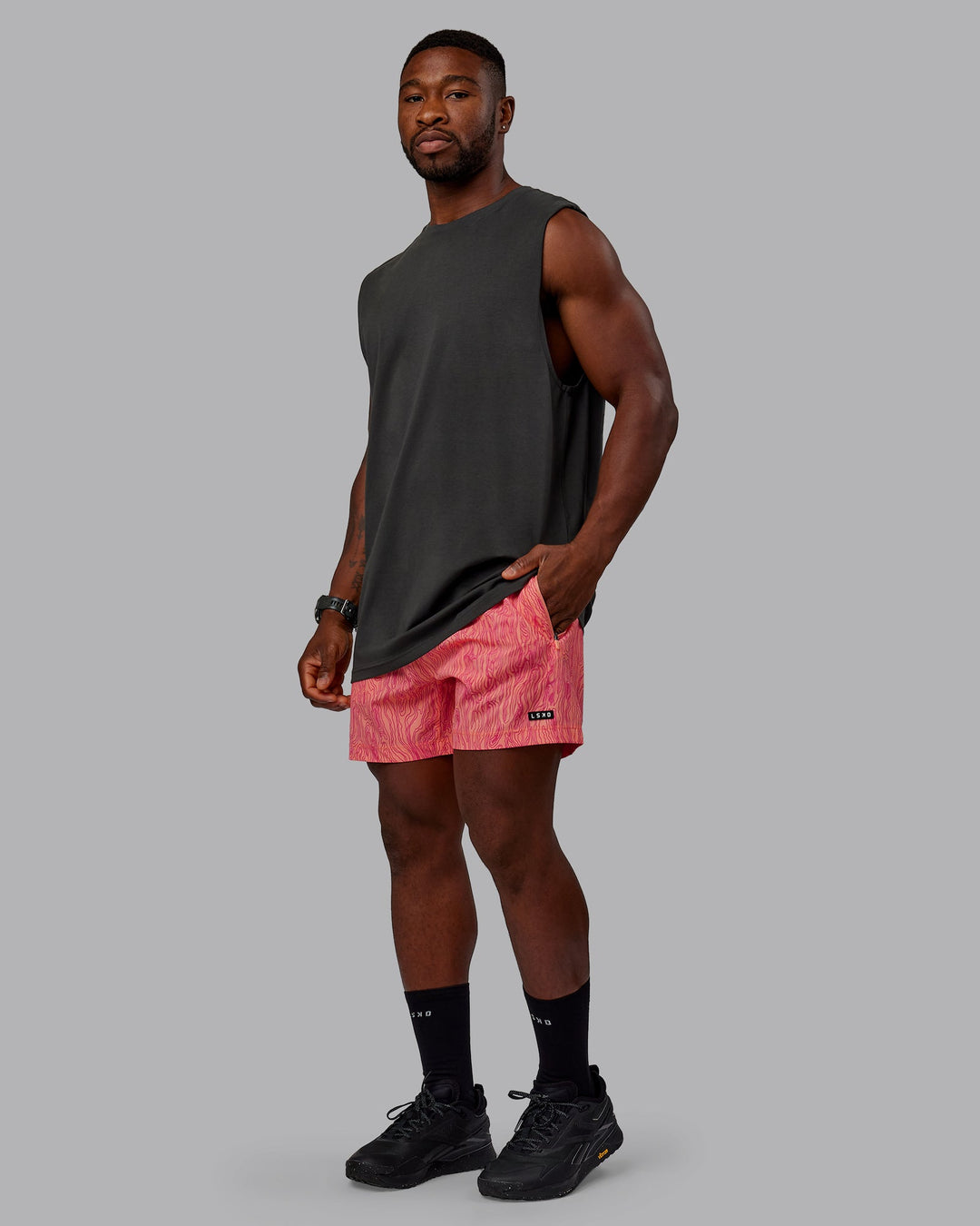 Man wearing Rep 5&quot; Performance Shorts - Topographic Peach