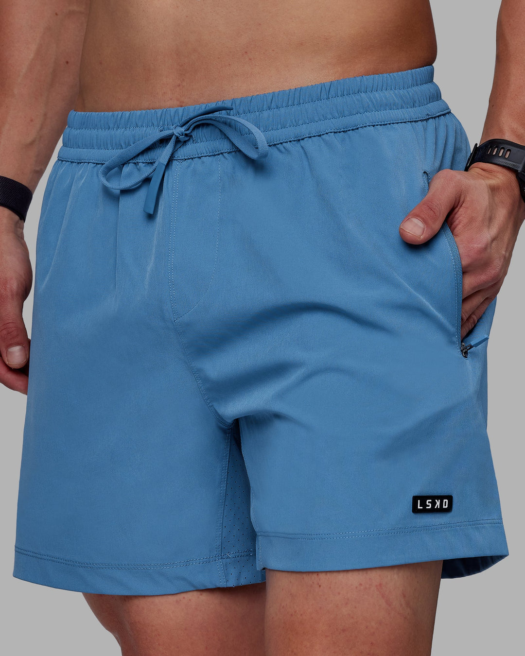 Man wearing Rep 5&quot; Performance Shorts - Elemental Blue