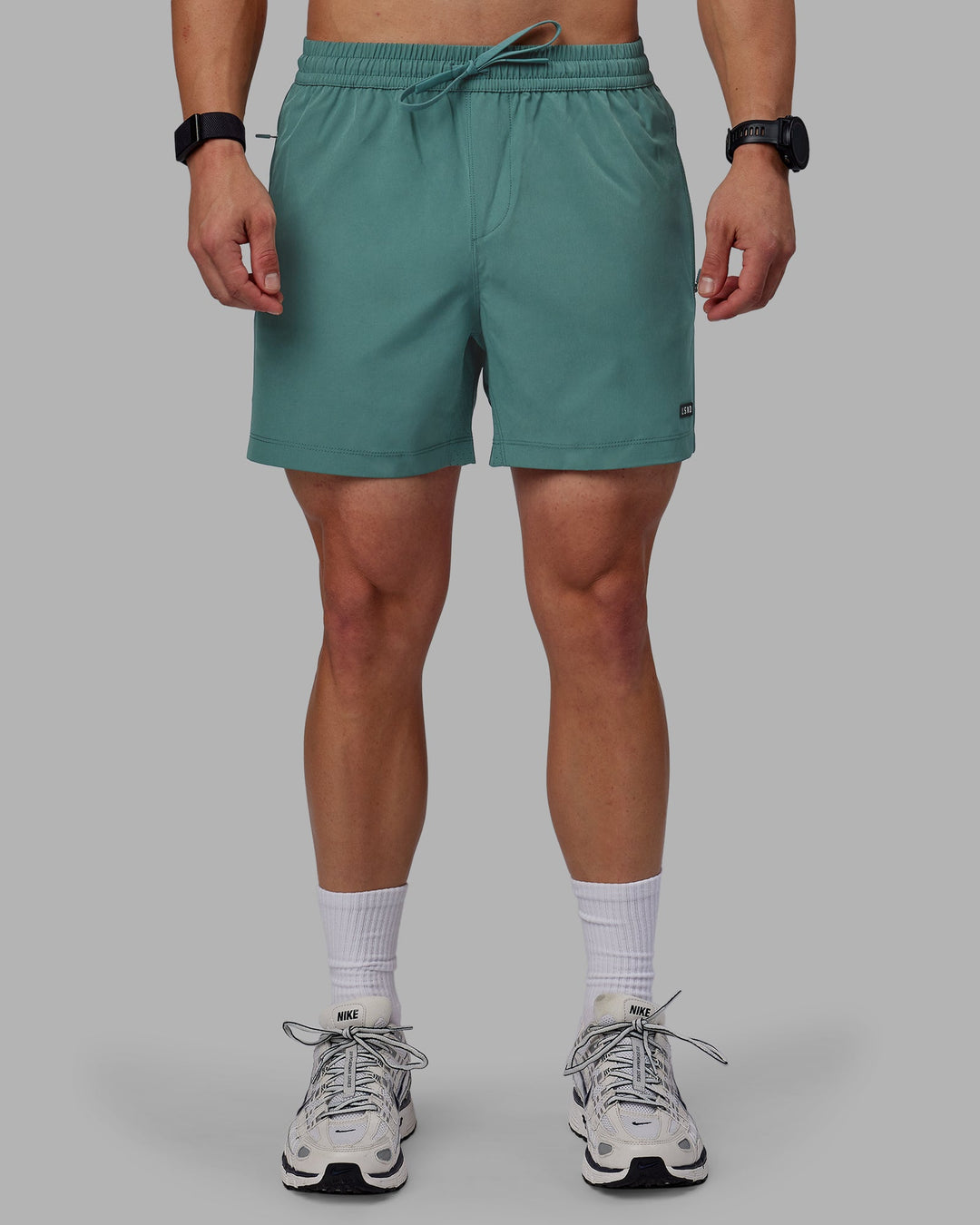 Man wearing Rep 5&quot; Performance Shorts - Sage Bush