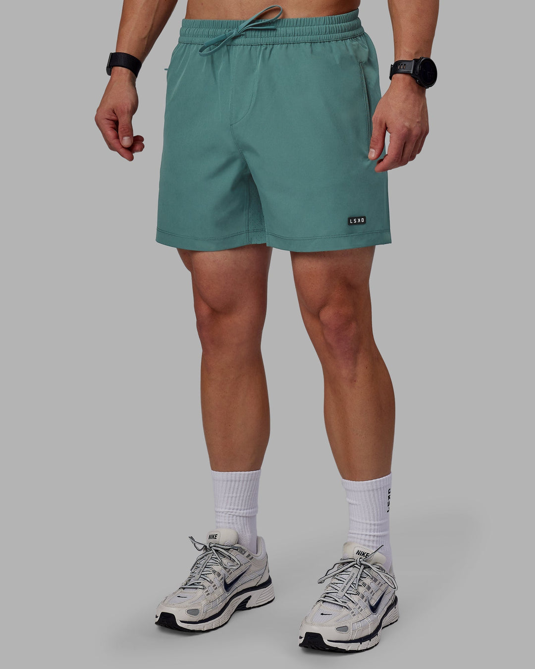 Man wearing Rep 5&quot; Performance Shorts - Sage Bush