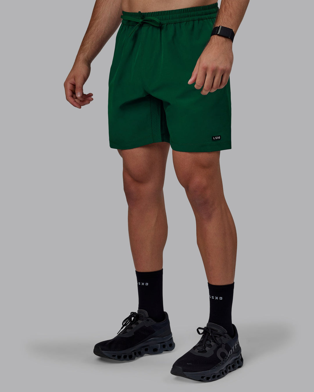 Man wearing Rep 7&quot; Performance Shorts - Deep Emerald