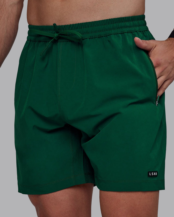 Man wearing Rep 7&quot; Performance Shorts - Deep Emerald
