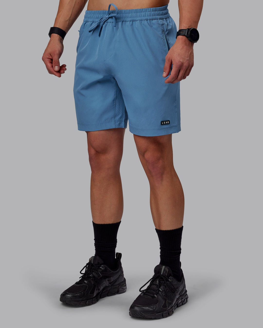 Man wearing Rep 7&quot; Performance Shorts - Elemental Blue