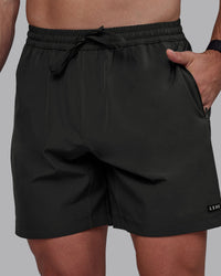 Man wearing Rep 7" Performance Shorts - Pirate Black