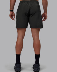 Man wearing Rep 7" Performance Shorts - Pirate Black
