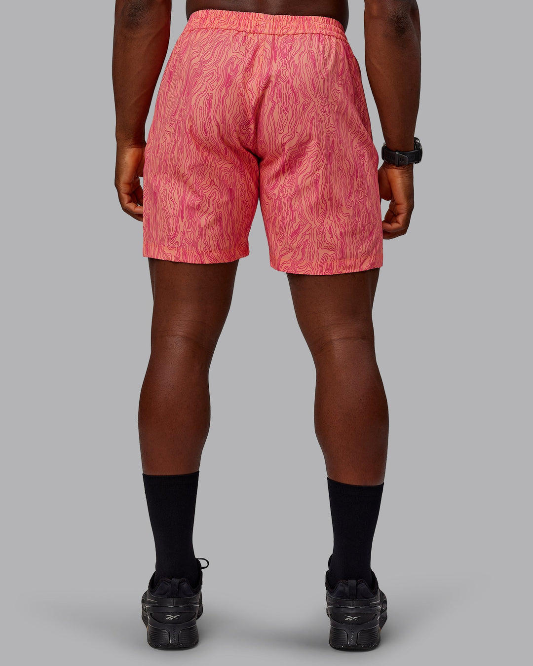 Man wearing Rep 7&quot; Performance Shorts - Topographic Peach