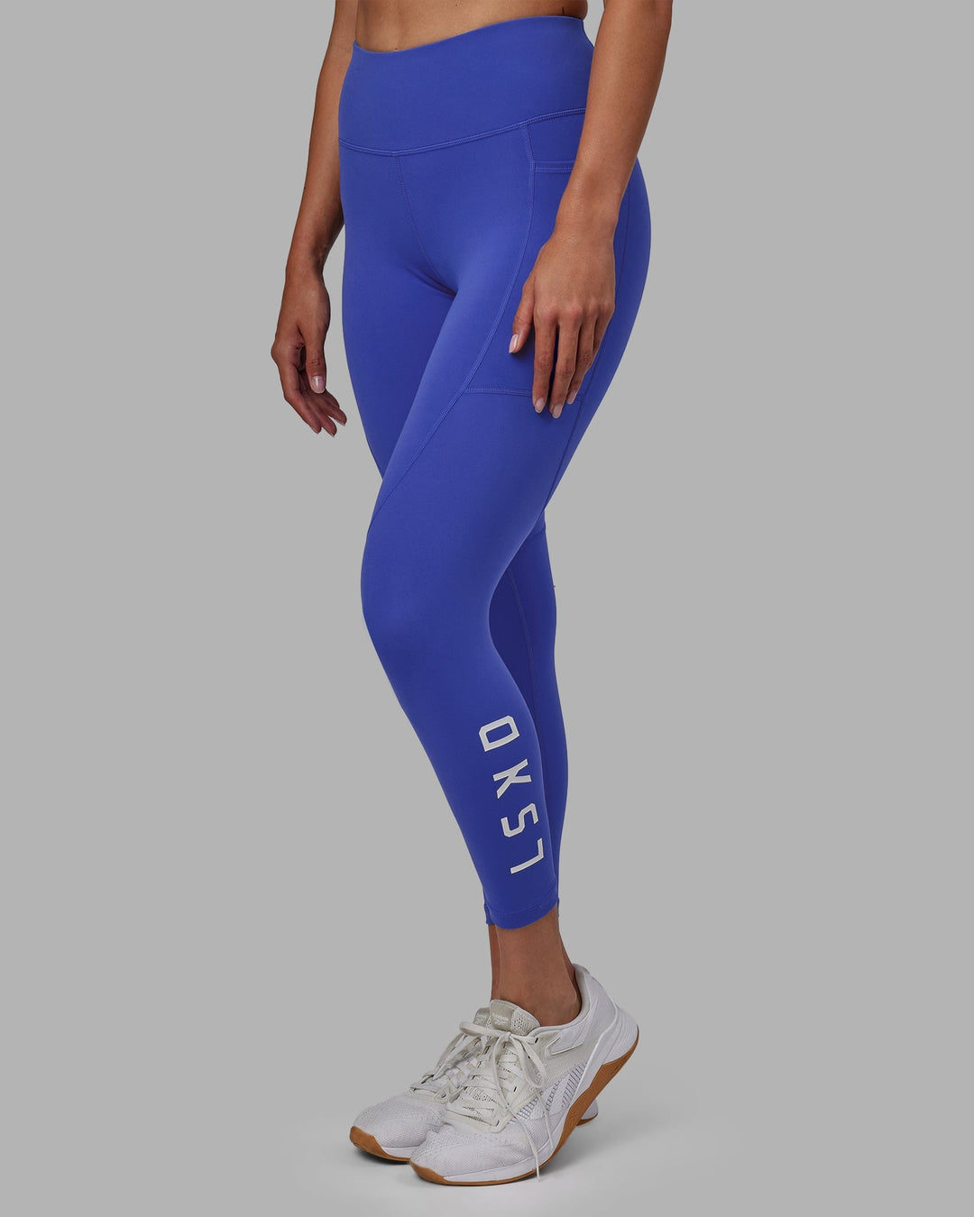 Woman wearing Rep 7/8 Length Leggings - Power Cobalt-White