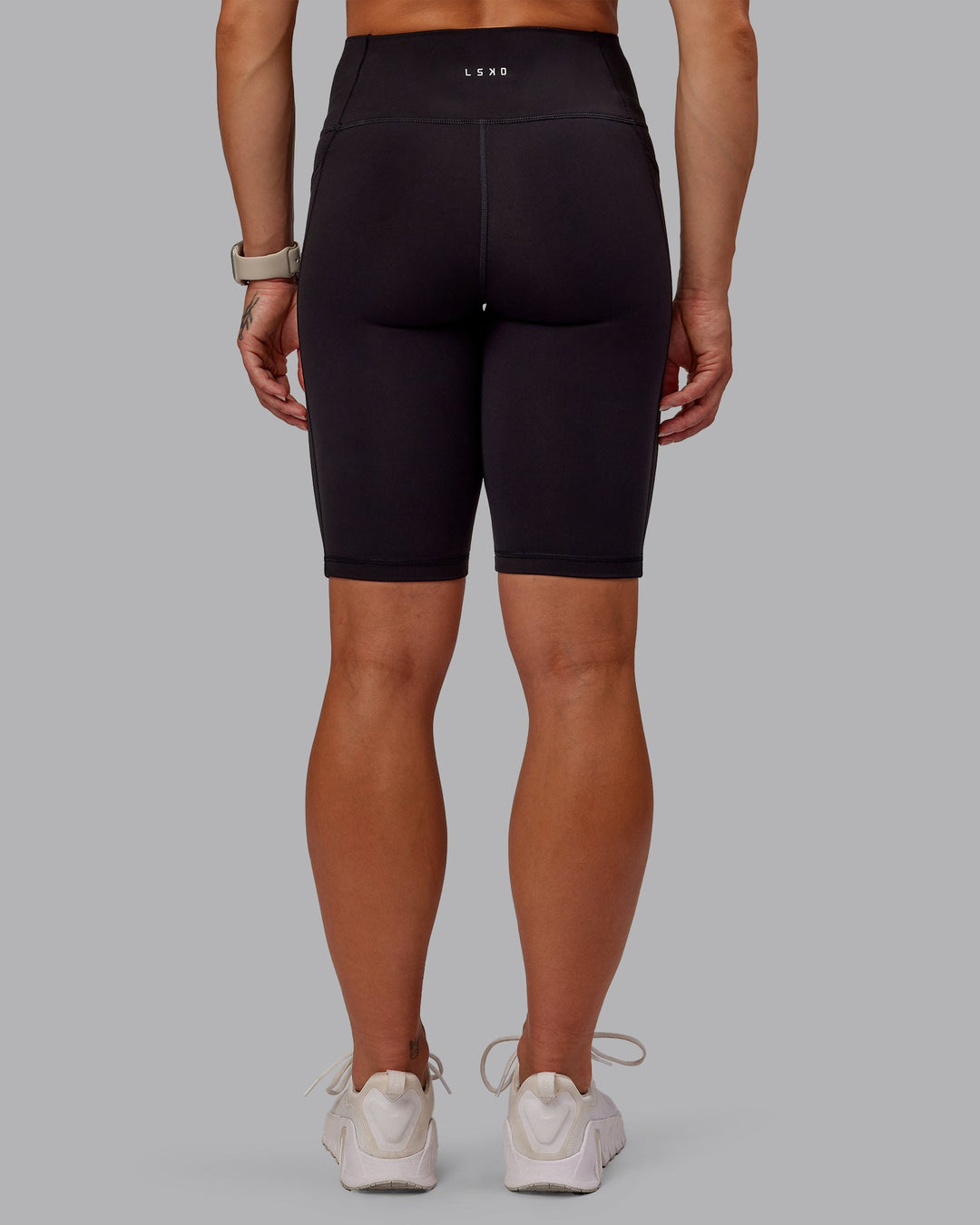 Woman wearing Rep Bike Shorts - Black-Surreal Green