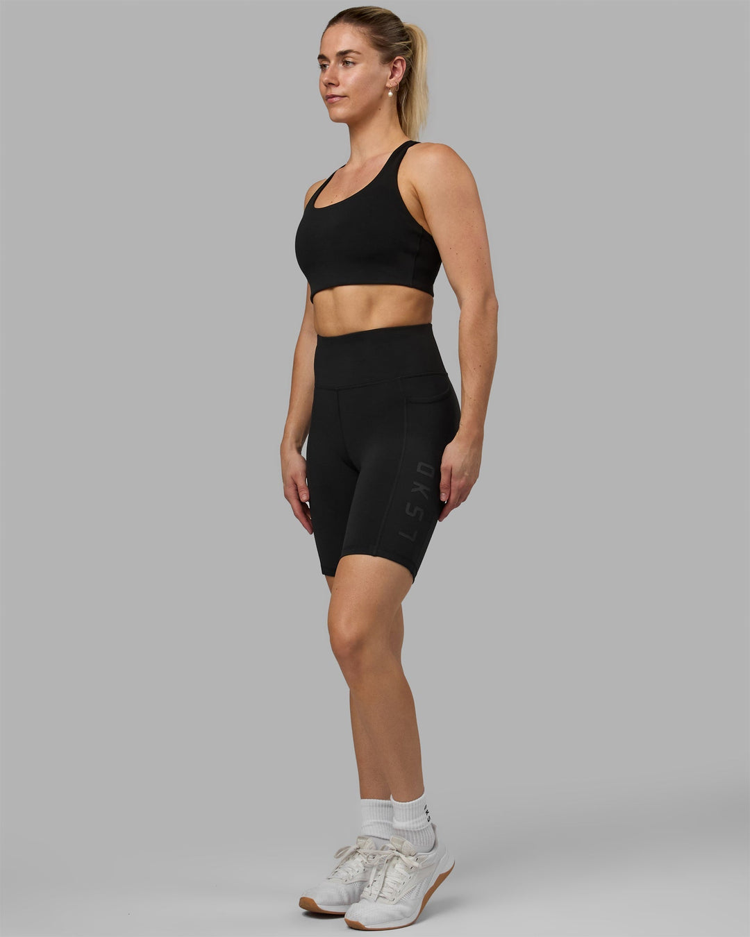 Woman wearing Rep Bike Shorts - Black-Black