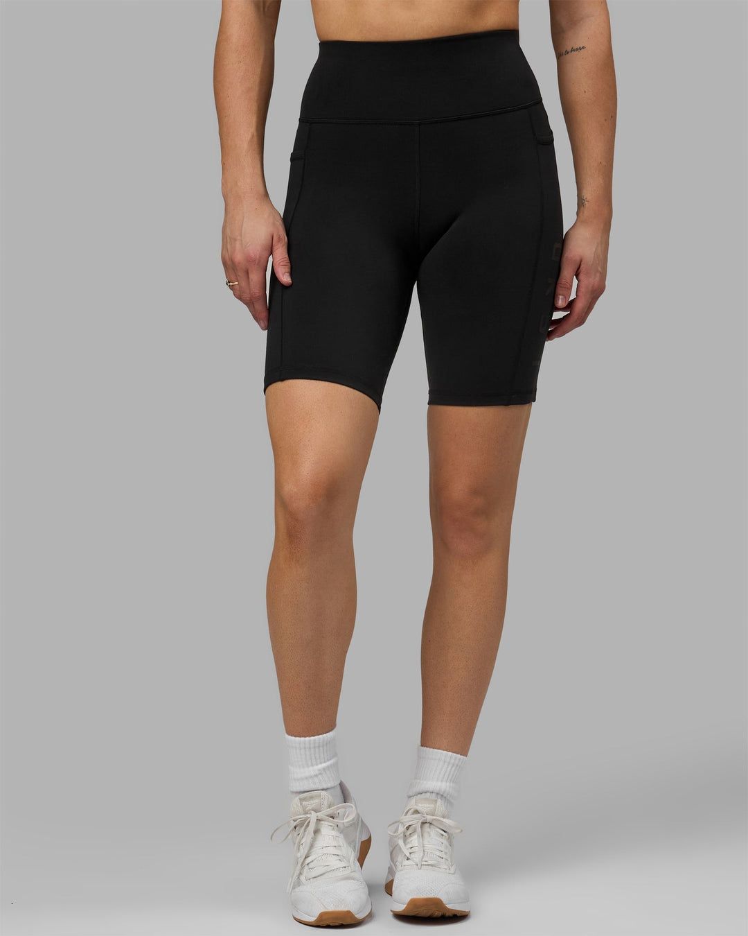 Woman wearing Rep Bike Shorts - Black-Black