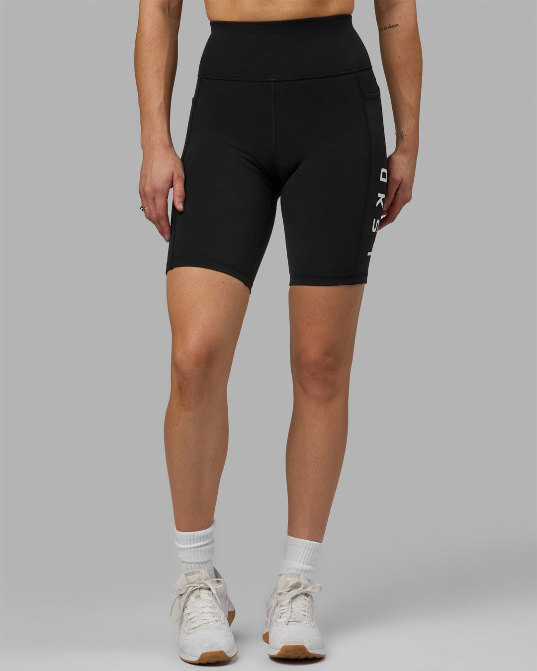 Woman wearing Rep Bike Shorts - Black-White