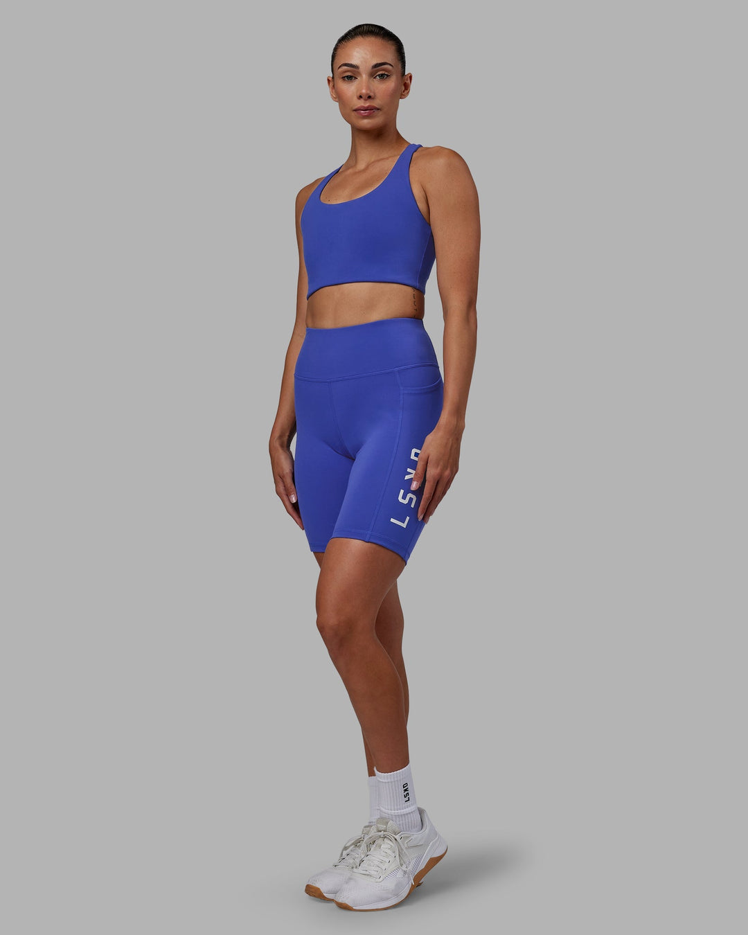 Woman wearing Rep Bike Shorts - Power Cobalt-White