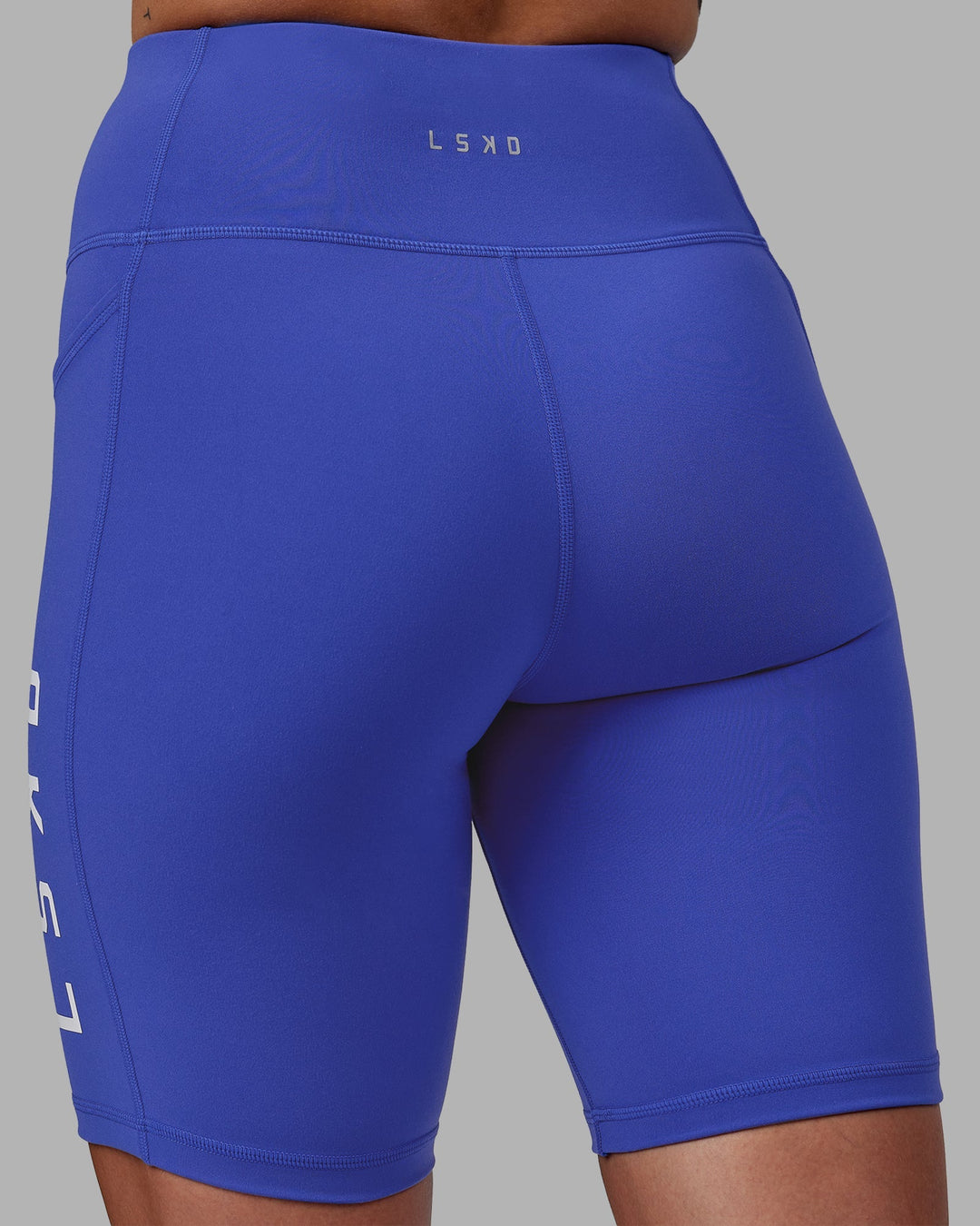 Woman wearing Rep Bike Shorts - Power Cobalt-White