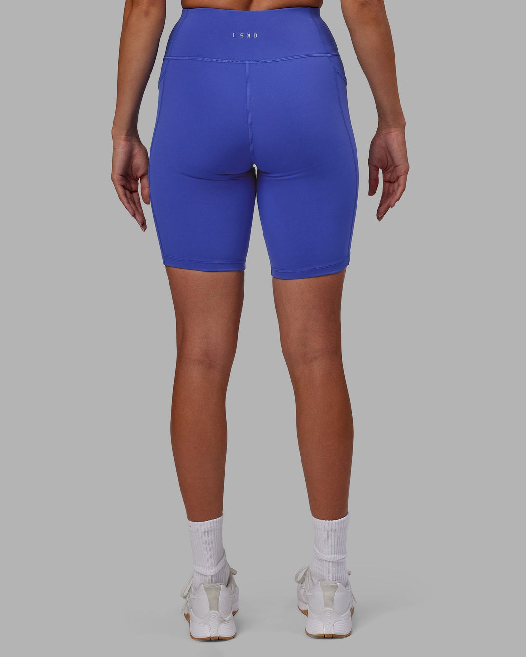 Woman wearing Rep Bike Shorts - Power Cobalt-White