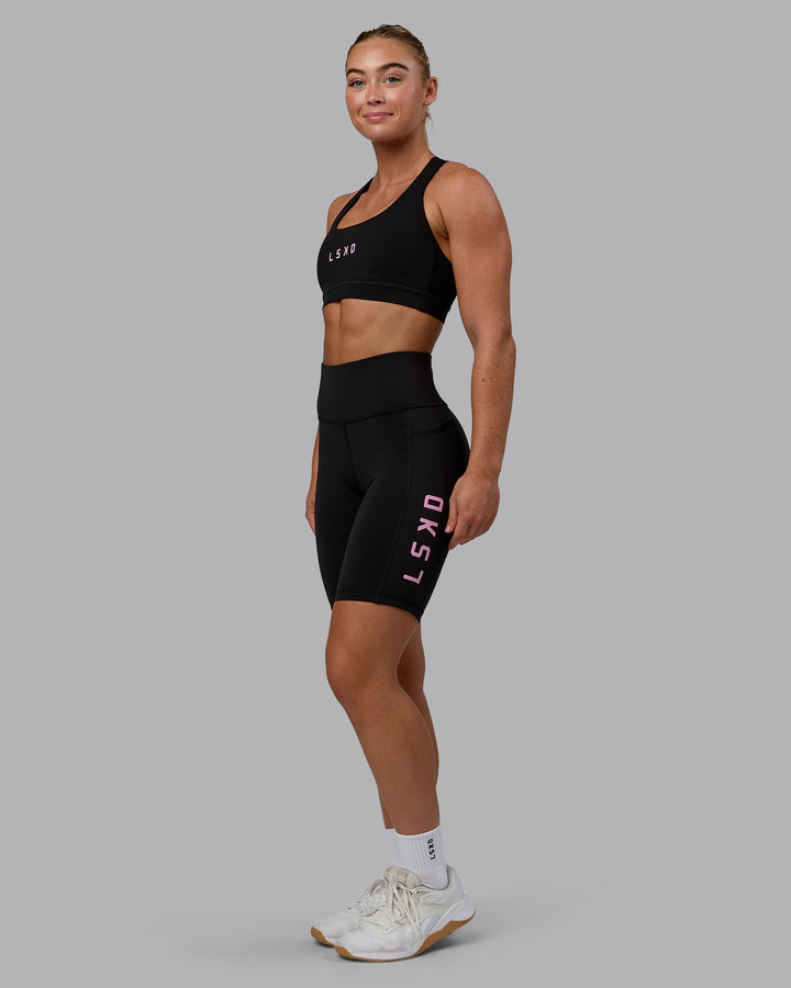 Woman wearing Rep Bike Shorts - Black-Bubblegum
