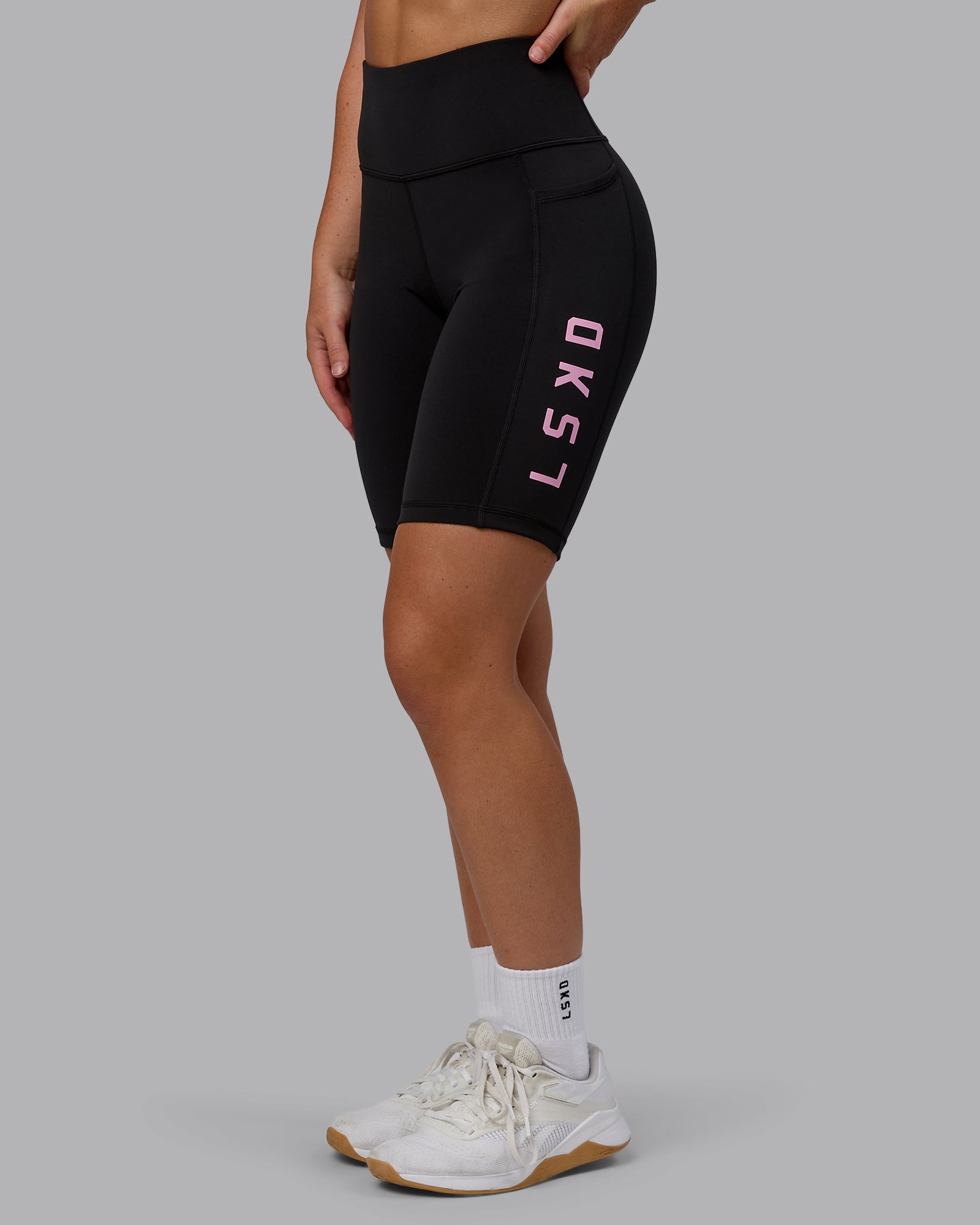 Woman wearing Rep Ultra High-Rise 9" Short Pockets - Black-Bubblegum