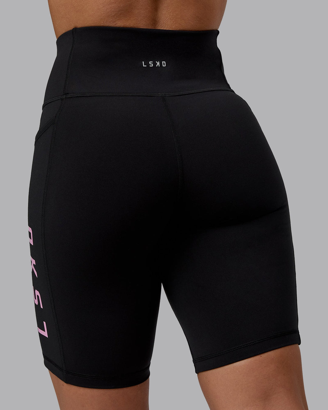 Woman wearing Rep Bike Shorts - Black-Bubblegum