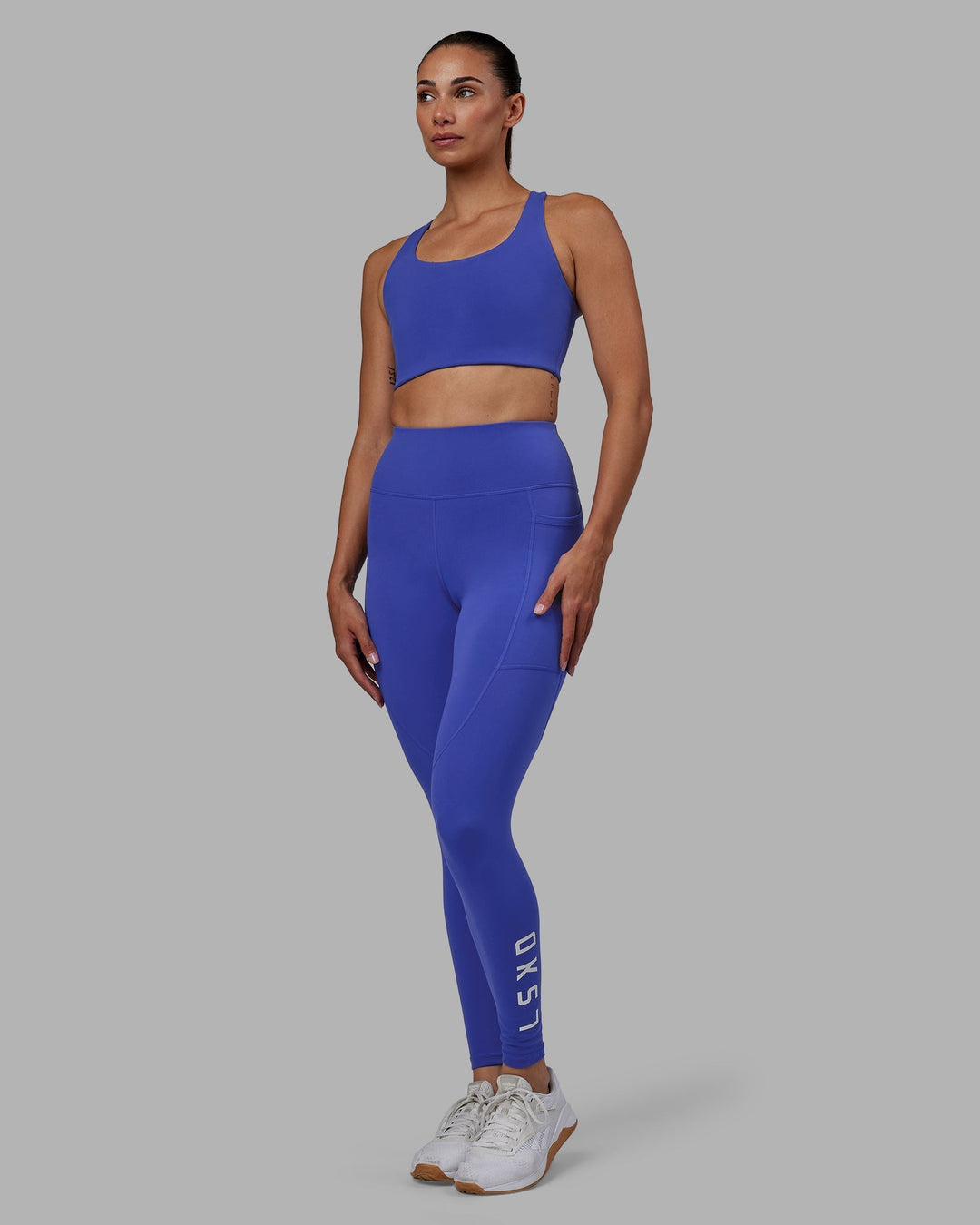 Woman wearing Rep Full Length Leggings - Power Cobalt-White