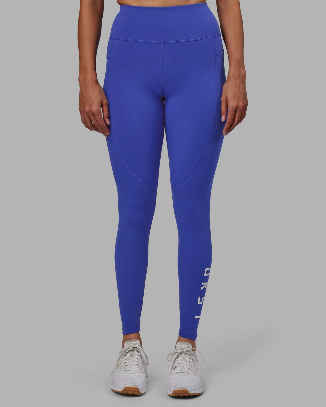 Woman wearing Rep Full Length Leggings - Power Cobalt-White