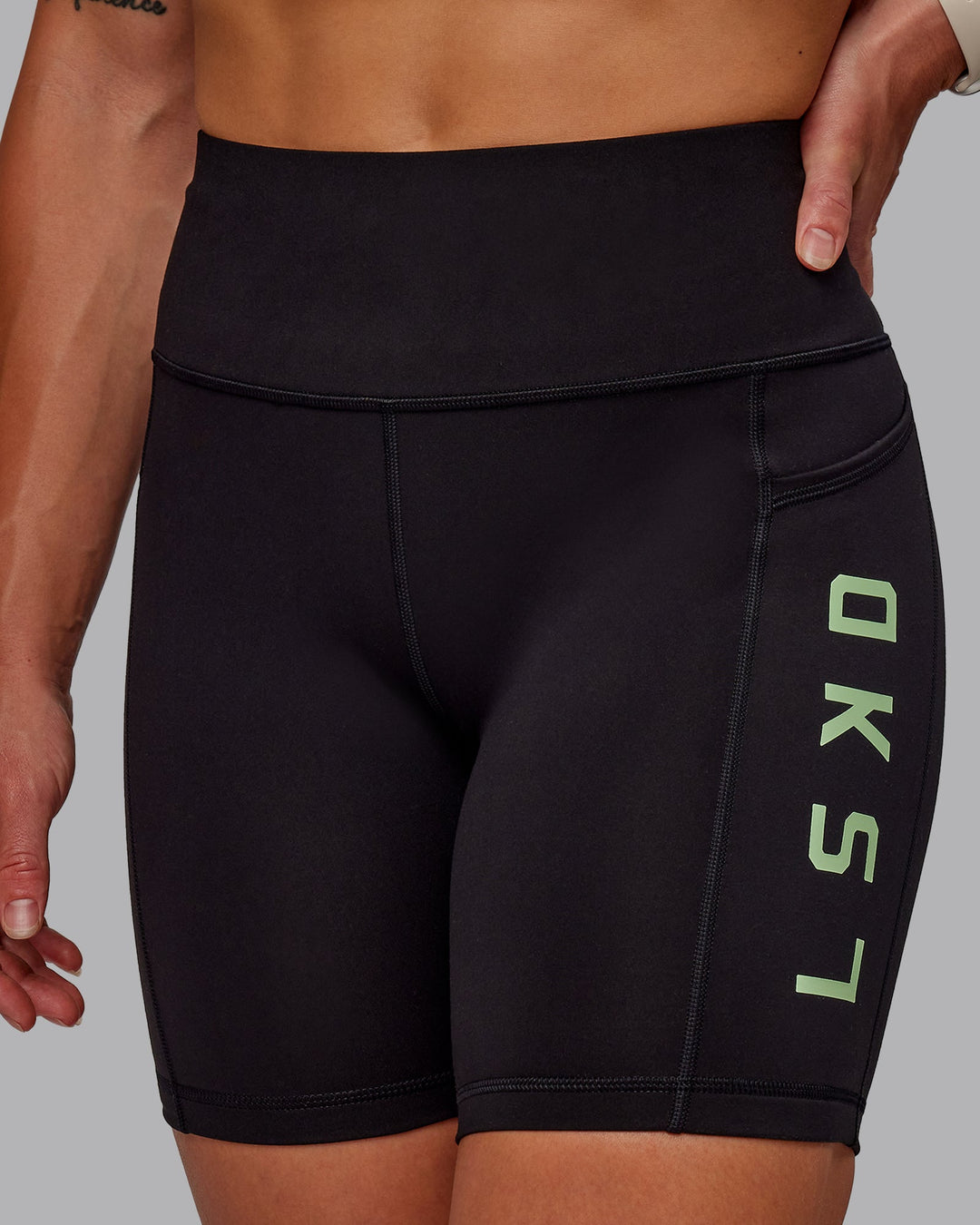 Woman wearing Rep Ultra High-Rise 6&quot; Short Pockets - Black-Surreal Green