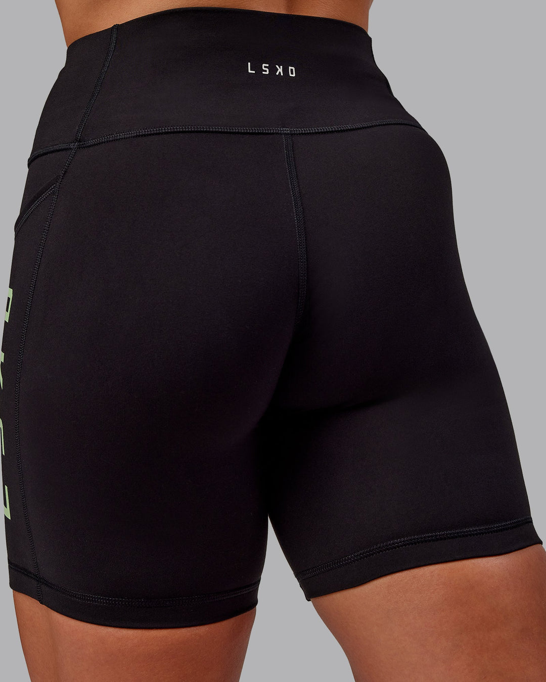 Woman wearing Rep Ultra High-Rise 6&quot; Short Pockets - Black-Surreal Green