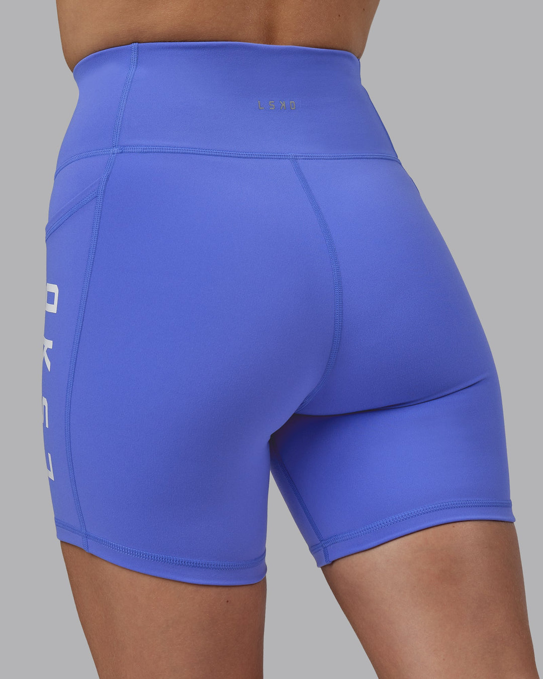 Woman wearing Rep Mid Short Tights - Baja Blue-White