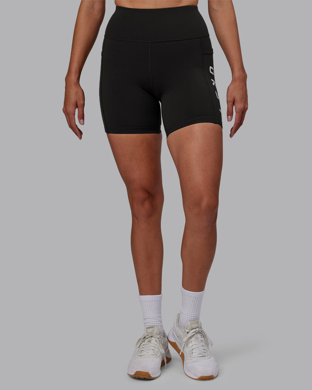 Woman wearing Rep Mid-Length Shorts - Pirate Black-White