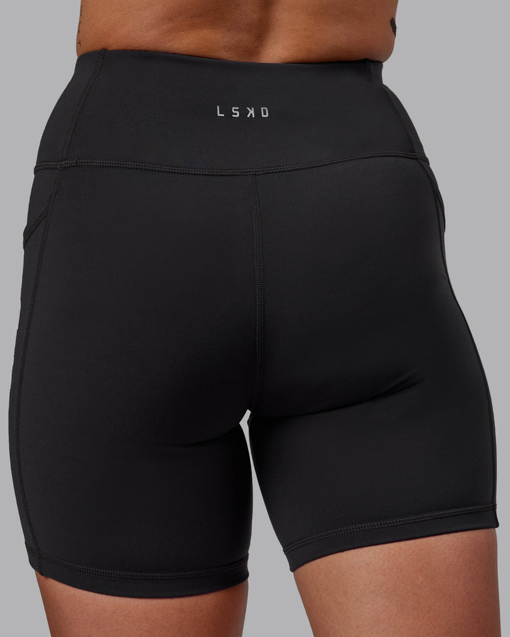 Woman wearing Rep Mid-Length Shorts - Pirate Black-White
